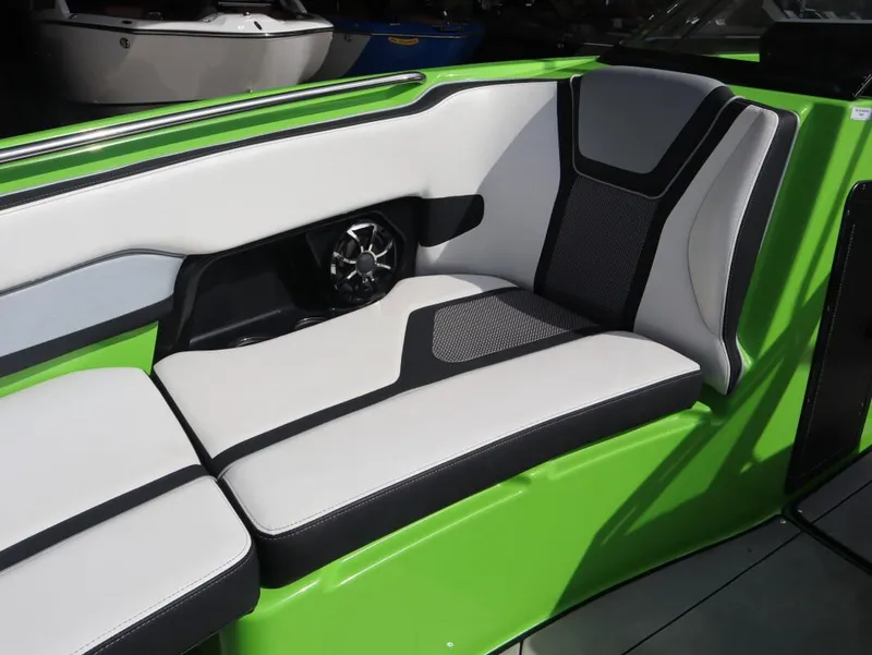 Slide: The Image of 2022 Yamaha Boats 255XD interior seating with green and black accents. - 24