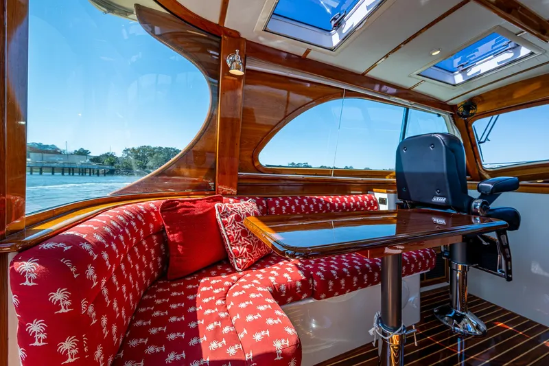 Slide: The Image of Interior of 2006 Hinckley Talaria 44 MY yacht with helm, navigation screens, and luxurious seating. - 10