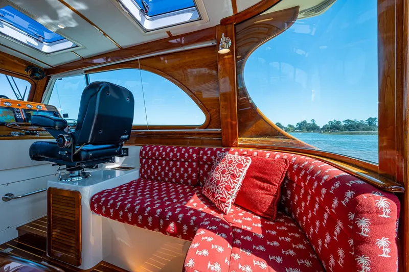 Slide: The Image of 2006 Hinckley Talaria 44 MY interior with captain's chair and scenic water view. - 11