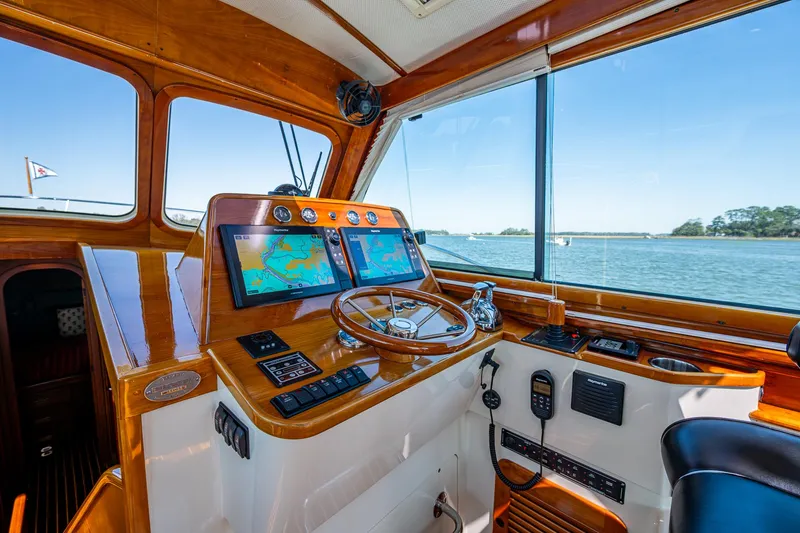 Slide: The Image of Luxurious 2006 Hinckley Talaria 44 MY yacht interior with elegant seating and scenic views. - 13