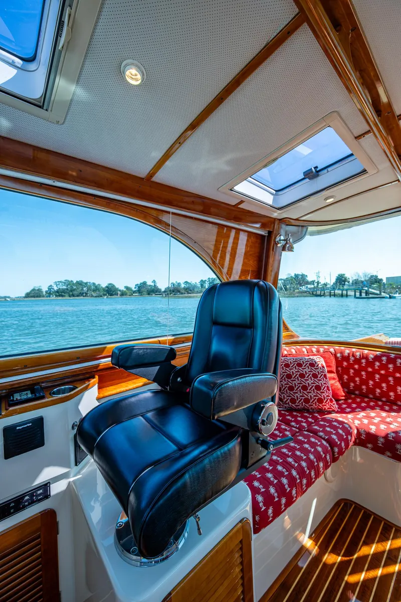 Slide: The Image of Hinckley Talaria 44 MY 2006 yacht with American flag, cruising on a sunny day. - 15