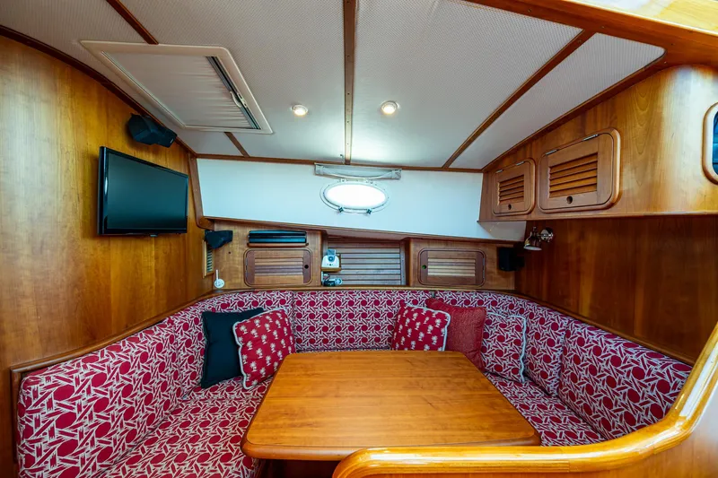 Slide: The Image of Luxurious 2006 Hinckley Talaria 44 MY yacht kitchen with wood cabinetry and granite countertops. - 21