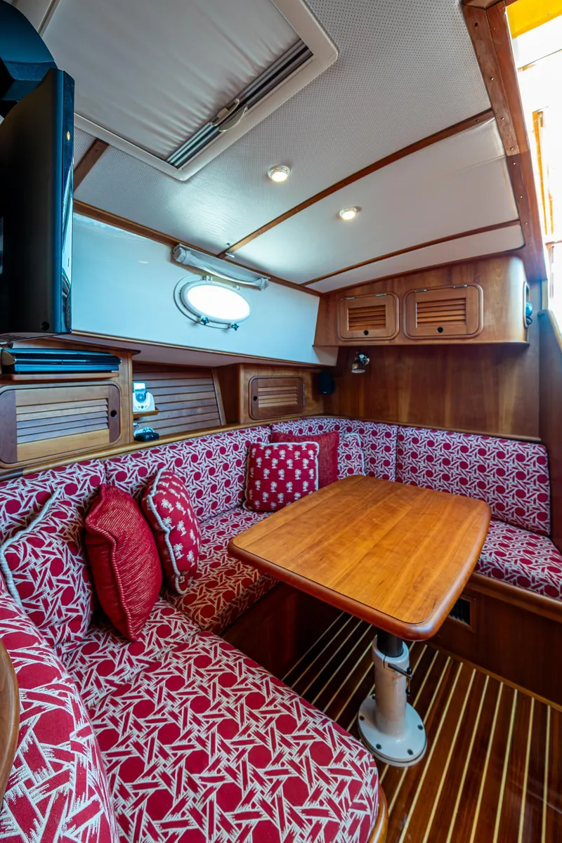 Slide: The Image of Interior of 2006 Hinckley Talaria 44 MY yacht with wood paneling and patterned seating. - 22