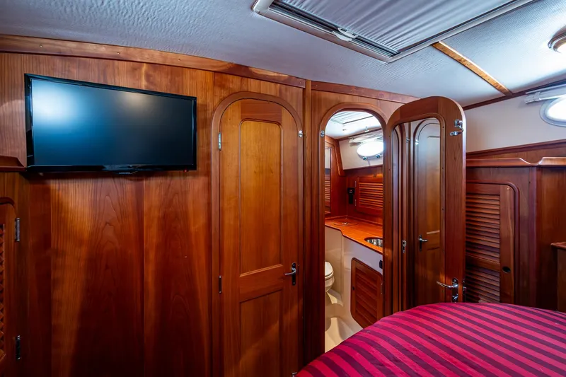 Slide: The Image of Interior of 2006 Hinckley Talaria 44 MY yacht with wood paneling and TV. - 26