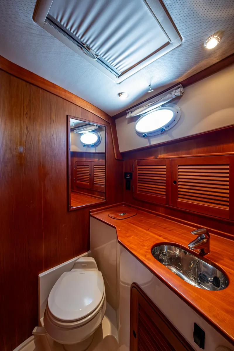 Slide: The Image of Luxury bathroom interior of 2006 Hinckley Talaria 44 MY yacht with wood accents and modern fixtures. - 27