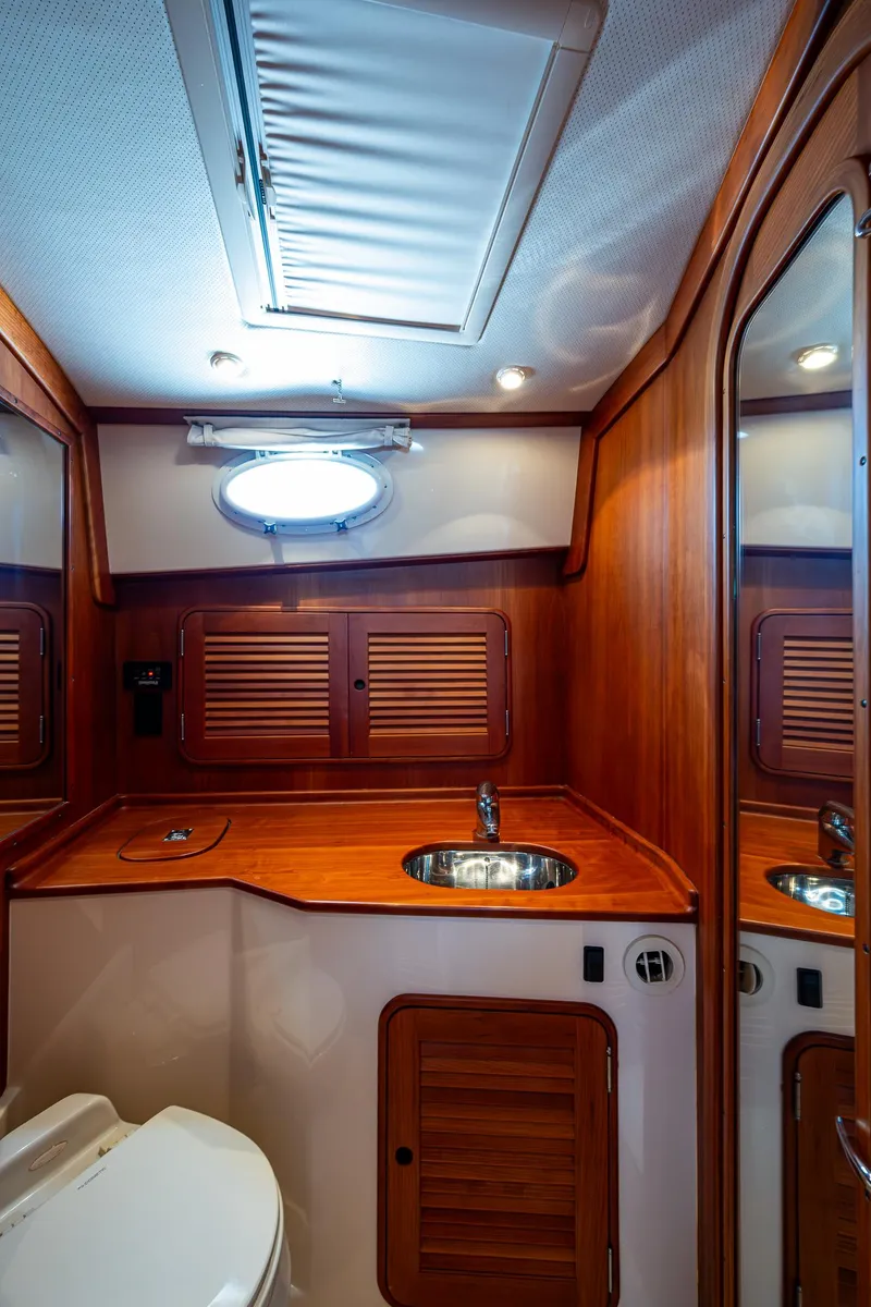 Slide: The Image of Luxurious 2006 Hinckley Talaria 44 MY yacht bathroom with wood accents and modern fixtures. - 28