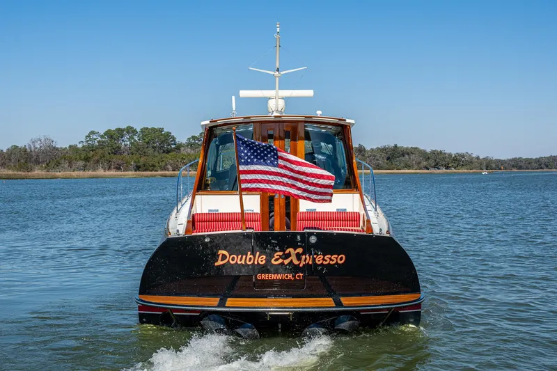 Slide: The Image of 2006 Hinckley Talaria 44 MY yacht cruising on a sunny day in a marina. - 3