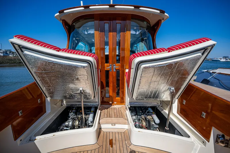 Slide: The Image of 2006 Hinckley Talaria 44 MY yacht engine compartment with open hatches, showcasing detailed craftsmanship. - 30
