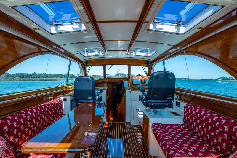Slide: The Image of Helm of 2006 Hinckley Talaria 44 MY with dual navigation screens and wooden interior. - 9