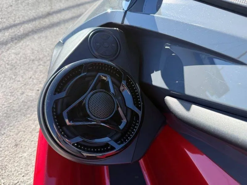 Slide: The Image of Close-up of 2024 Sea-Doo RXT-X 325 speaker and control panel. - 12