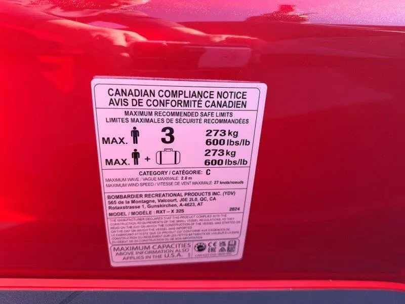 Slide: The Image of 2024 Sea-Doo RXT-X 325 compliance label detailing weight limits and safety information. - 13