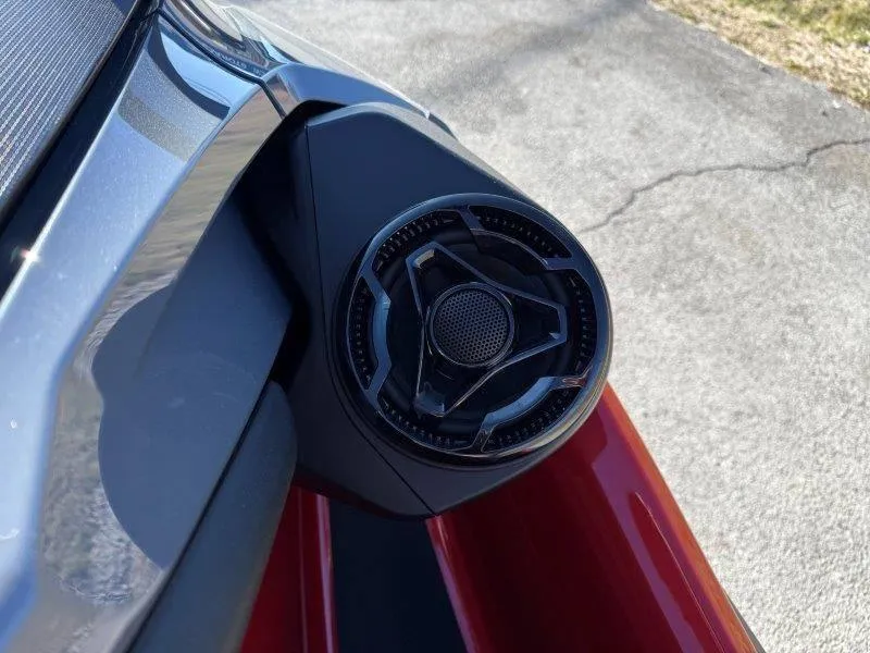 Slide: The Image of 2024 Sea-Doo RXT-X 325 speaker detail on a sunny day. - 18