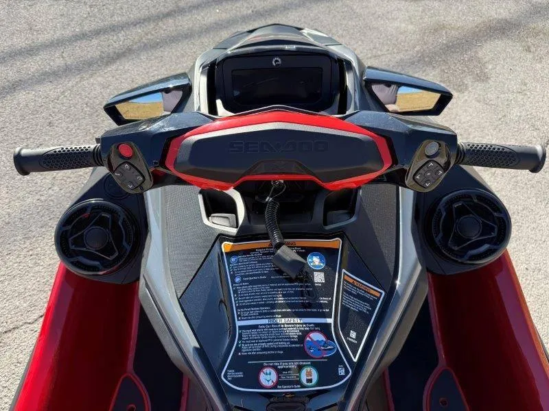 Slide: The Image of 2024 Sea-Doo RXT-X 325 dashboard and handlebars, featuring sleek design and controls. - 19
