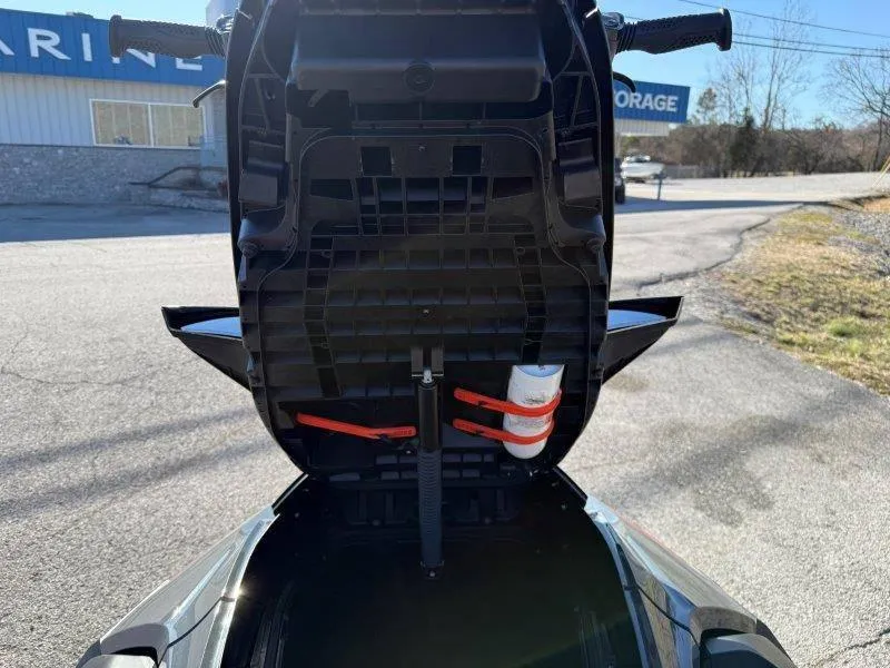 Slide: The Image of 2024 Sea-Doo RXT-X 325 storage compartment open, showing interior details and accessories. - 21