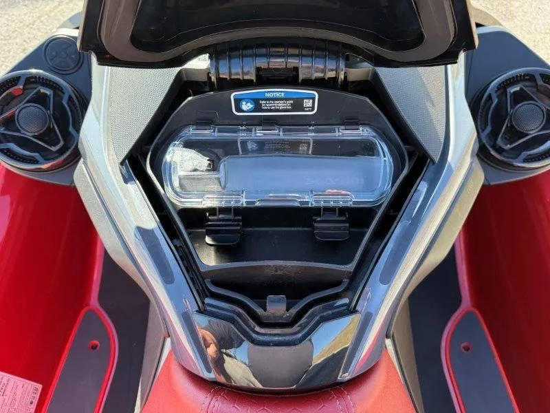 Slide: The Image of 2024 Sea-Doo RXT-X 325 storage compartment, open view, red and black design. - 22