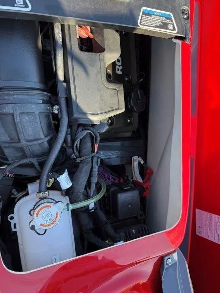 Slide: The Image of 2024 Sea-Doo RXT-X 325 engine compartment, showcasing internal components and wiring. - 24