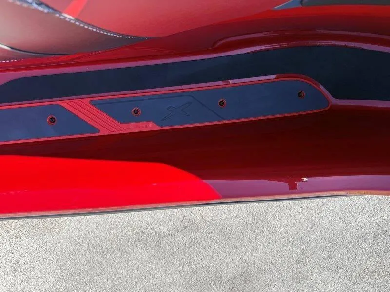 Slide: The Image of Close-up of 2024 Sea-Doo RXT-X 325 in vibrant red with sleek design details. - 35