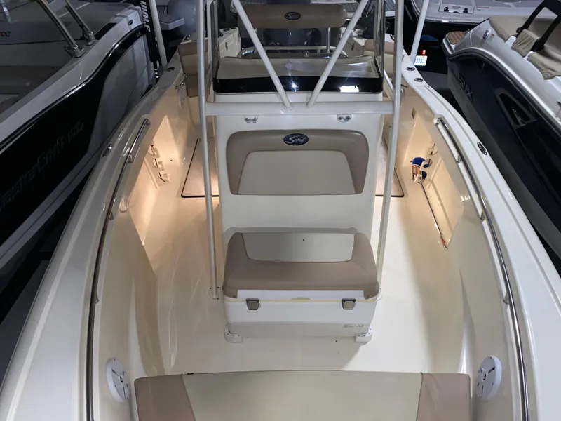 Slide: The Image of 2011 Scout 222 Sportfish boat interior with seating and console. - 45