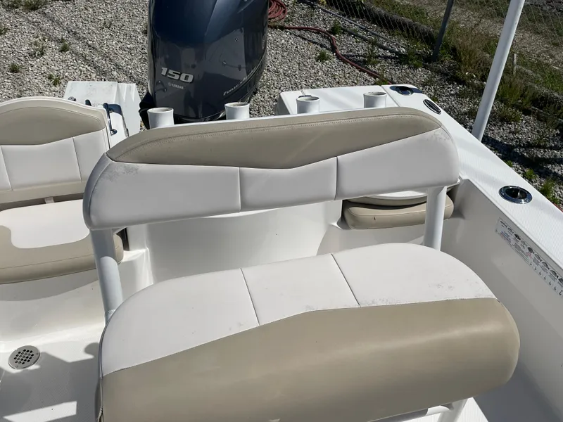 Slide: The Image of 2017 Robalo 206 Cayman boat interior with seating and 150 HP engine. - 10