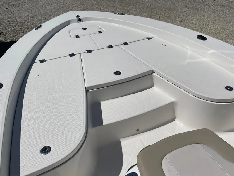 Slide: The Image of 2017 Robalo 206 Cayman boat deck with storage compartments and seating. - 6