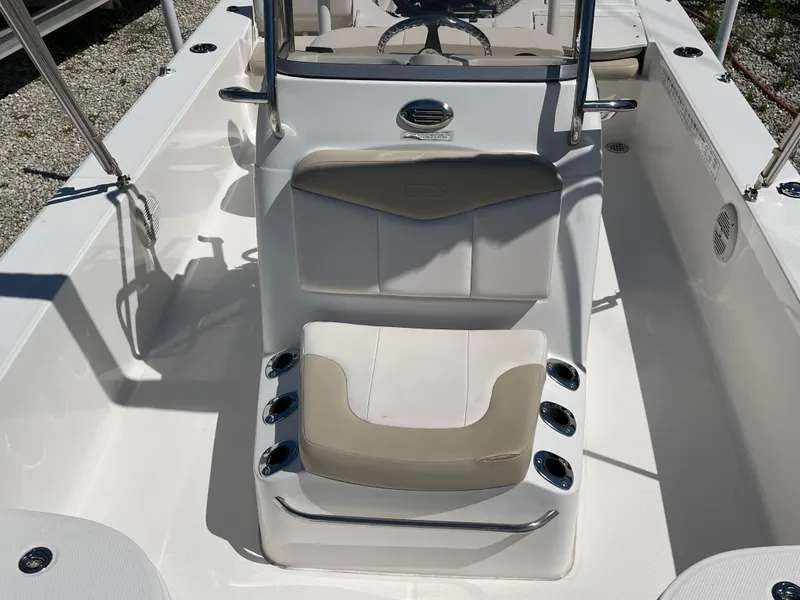Slide: The Image of 2017 Robalo 206 Cayman boat interior with seating and steering console. - 8