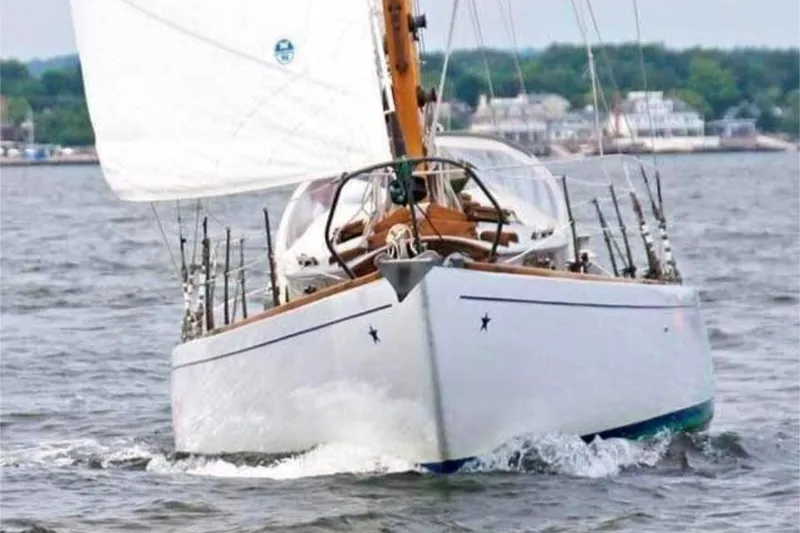 Slide: The Image of 1952 Concordia Yawl sailing on open water, showcasing classic design and craftsmanship. - 7