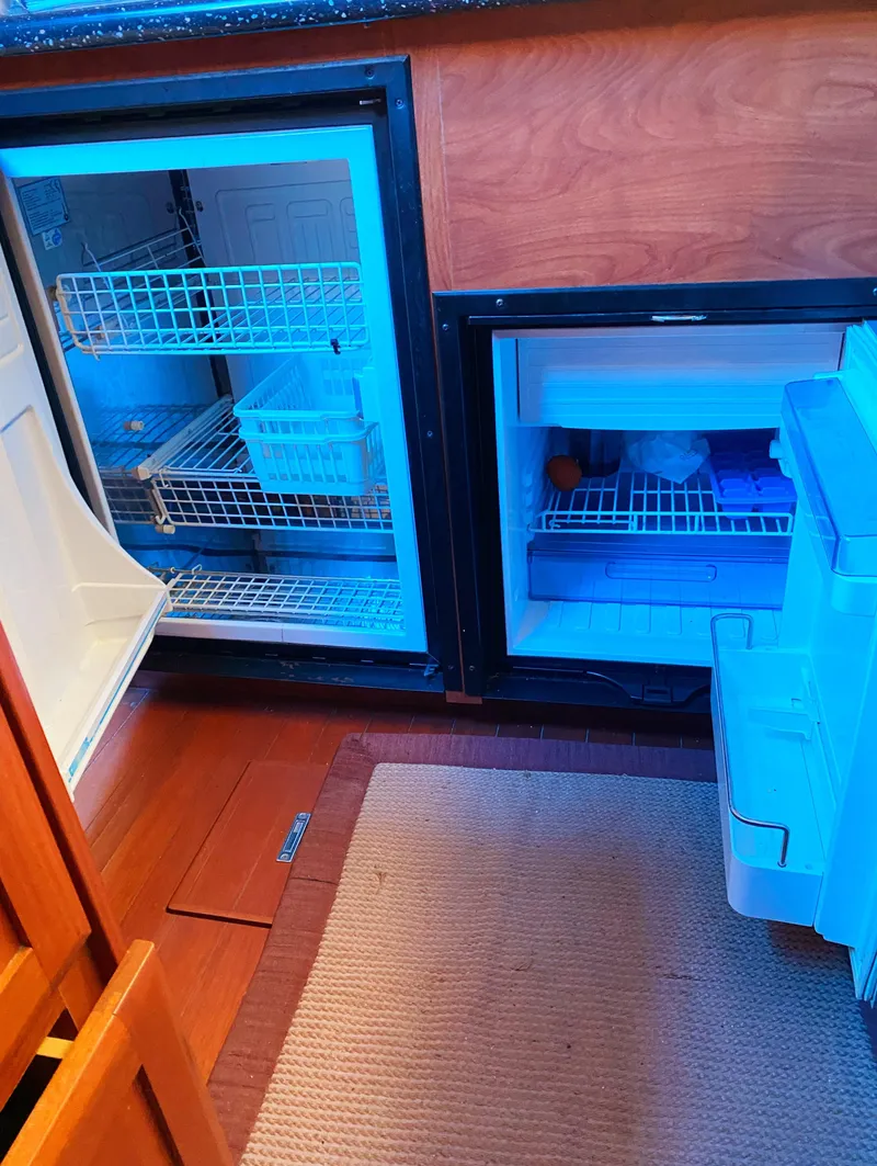 Slide: The Image of Open refrigerator and freezer in 2012 Hunter 50 Aft Cockpit yacht kitchen. - 12