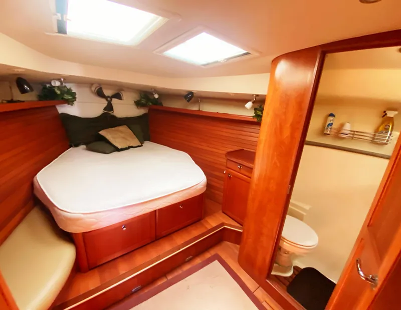 Slide: The Image of Luxurious 2012 Hunter 50 Aft Cockpit yacht interior with cozy bedroom and bathroom. - 26