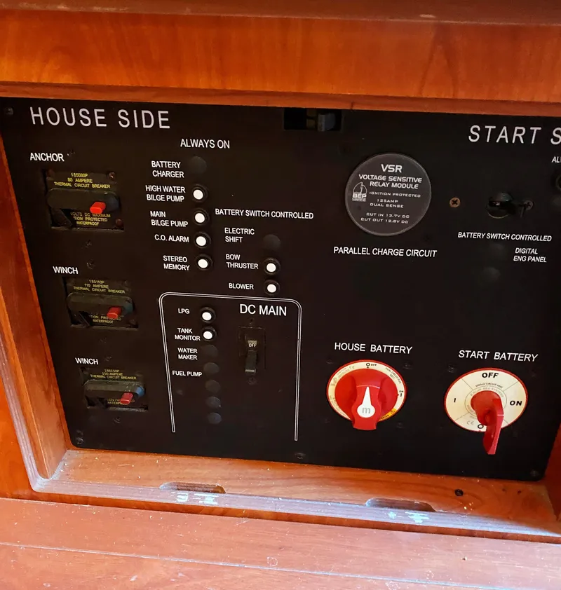 Slide: The Image of Control panel of a 2012 Hunter 50 Aft Cockpit yacht, featuring battery and switch controls. - 29