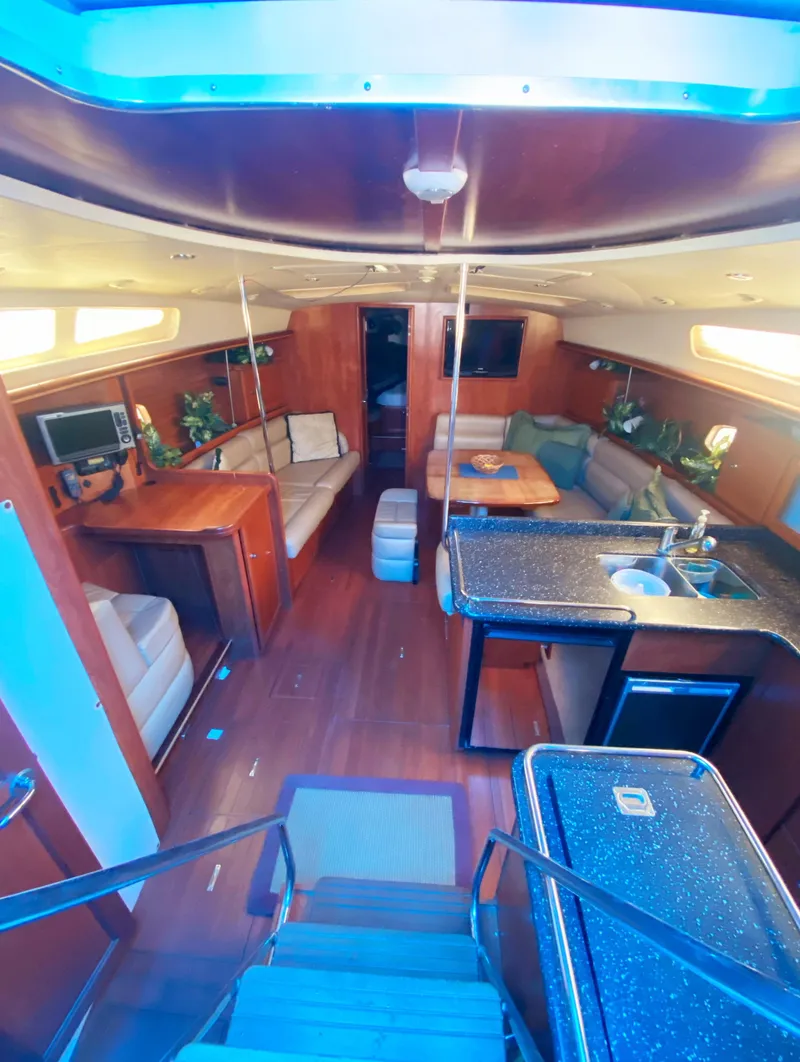 Slide: The Image of Luxurious interior of 2012 Hunter 50 Aft Cockpit yacht with modern amenities and seating. - 4