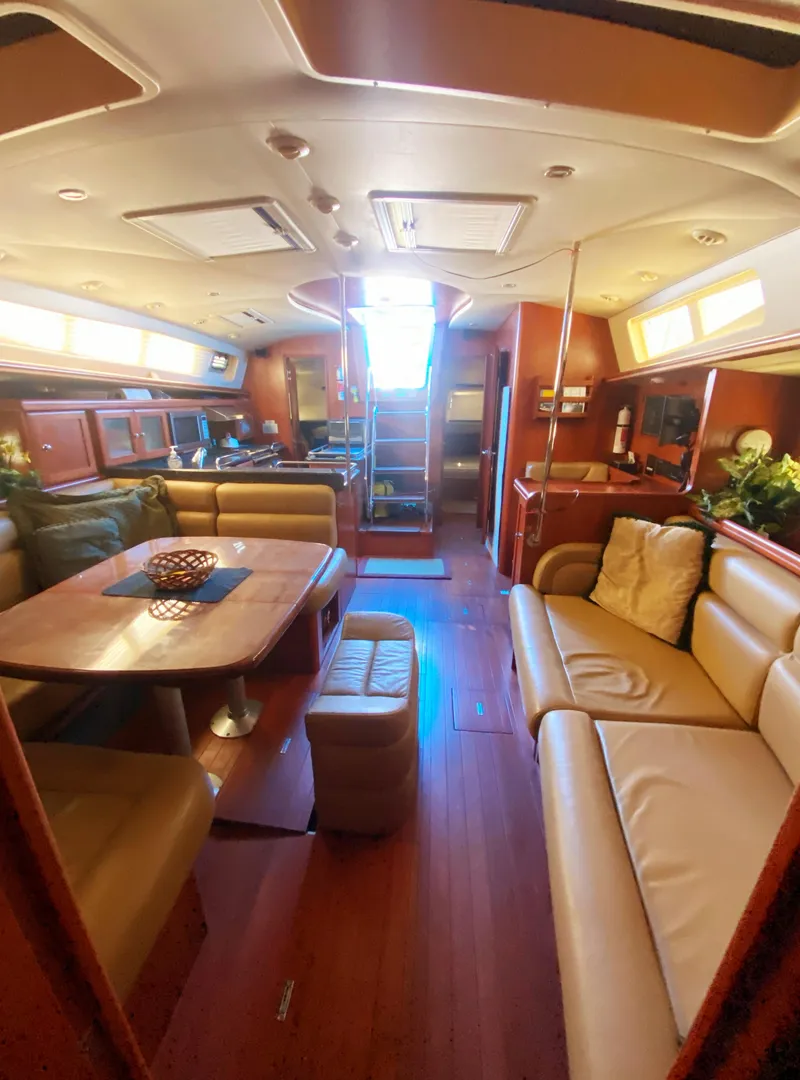 Slide: The Image of Luxurious interior of 2012 Hunter 50 Aft Cockpit yacht with elegant seating and dining area. - 5