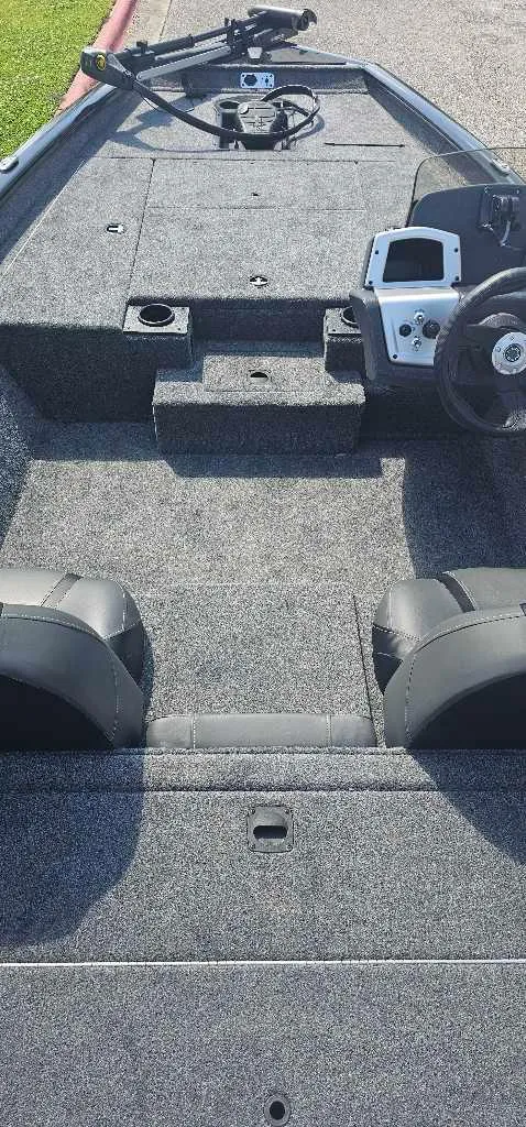 Slide: The Image of 2025 Tracker Pro Team 175 boat interior with steering console and seating. - 3