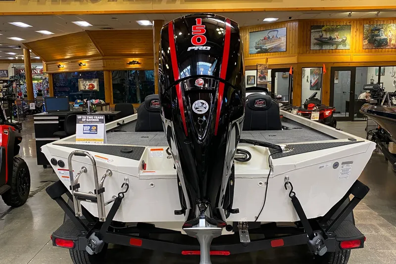 Slide: The Image of 2025 Ranger RT198P boat with 150 Pro motor displayed indoors. - 3
