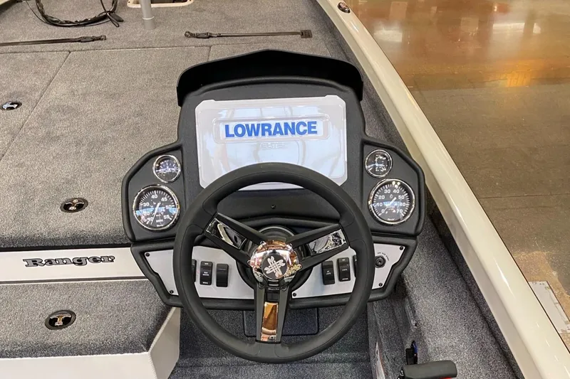 Slide: The Image of 2025 Ranger RT198P boat dashboard with Lowrance display and steering wheel. - 4