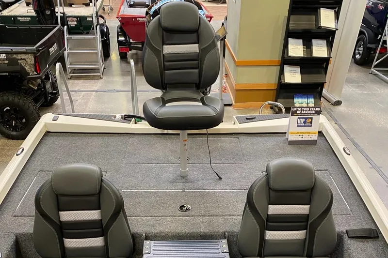 Slide: The Image of 2025 Ranger RT198P boat interior with three cushioned seats and carpeted flooring. - 6