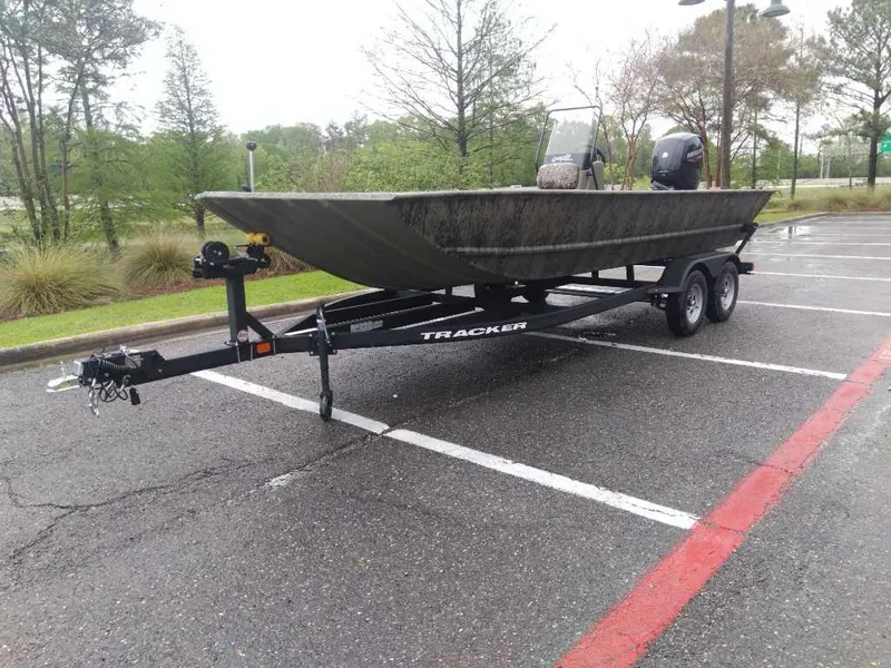 Slide: The Image of 2025 Tracker Grizzly 2072 CC boat on trailer in parking lot. - 13