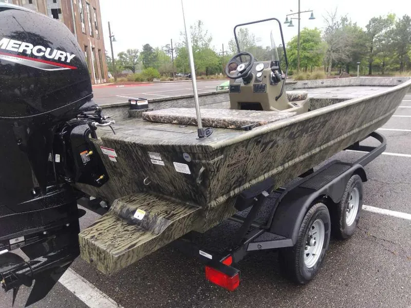 Slide: The Image of 2025 Tracker Grizzly 2072 CC boat on trailer with Mercury outboard motor. - 5