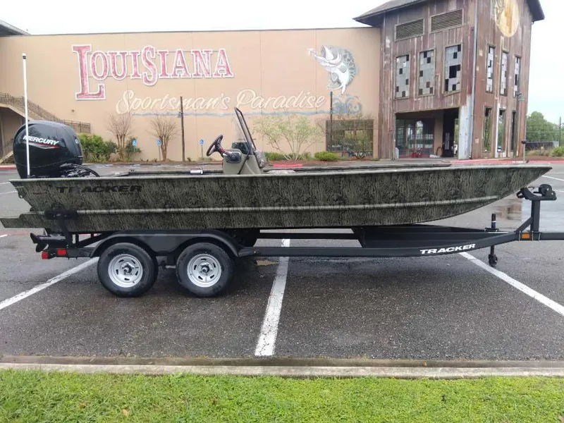 Slide: The Image of 2025 Tracker Grizzly 2072 CC boat on trailer, parked outside Louisiana Sportsman's Paradise. - 6