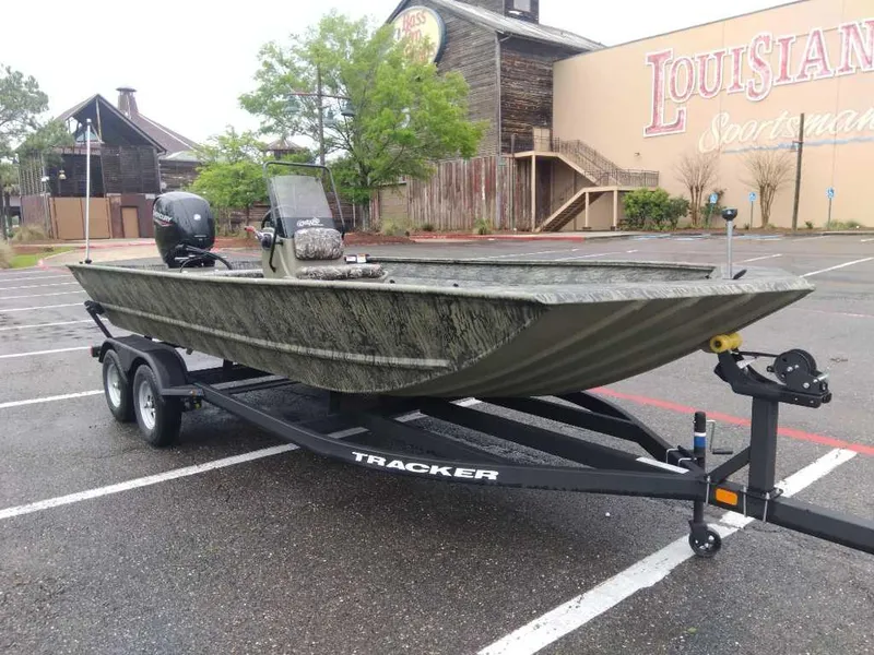 Slide: The Image of 2025 Tracker Grizzly 2072 CC boat on trailer in parking lot. - 7