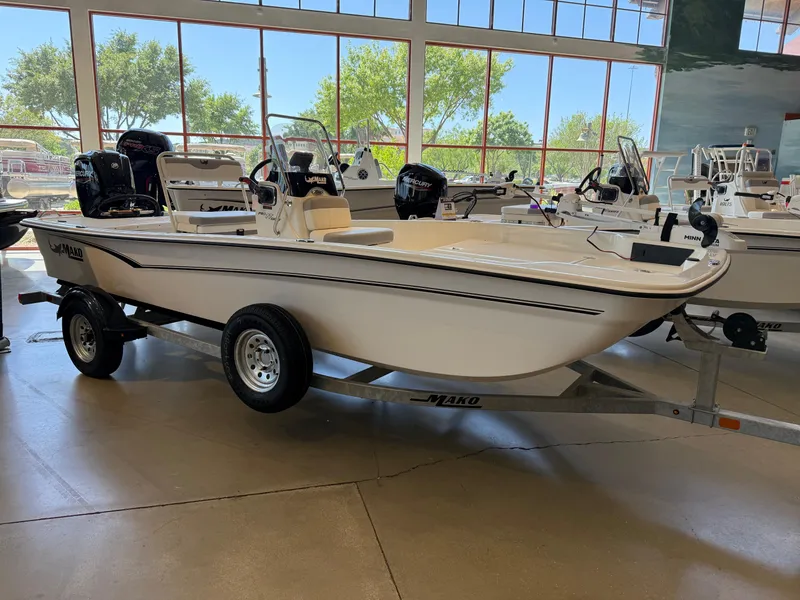 Slide: The Image of 2025 Mako Pro Skiff 17 CC boat on display in showroom. - 1