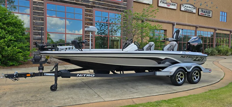 The Image of 2025 Nitro Z21 XL Pro boat on trailer outside dealership. - 0