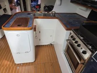 Slide: The Image of Interior of 2005 Dencho Marine Kernan 68 yacht kitchen with stove and sink. - 20