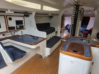 Slide: The Image of Interior of 2005 Dencho Marine Kernan 68 yacht with seating and navigation area. - 22
