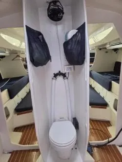 Slide: The Image of Dencho Marine Kernan 68 yacht interior with toilet, 2005 model, featuring wooden flooring. - 25