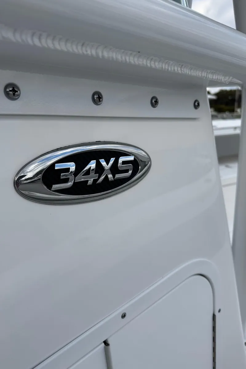 Slide: The Image of 2025 Cape Horn 34 XS boat emblem on white surface. - 10