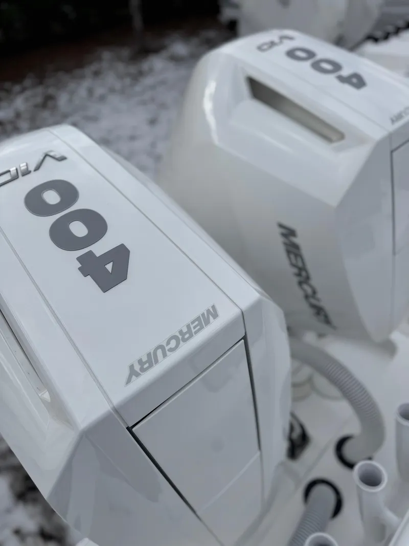 Slide: The Image of 2025 Cape Horn 34 XS with Mercury 400 outboard engines, close-up view. - 13