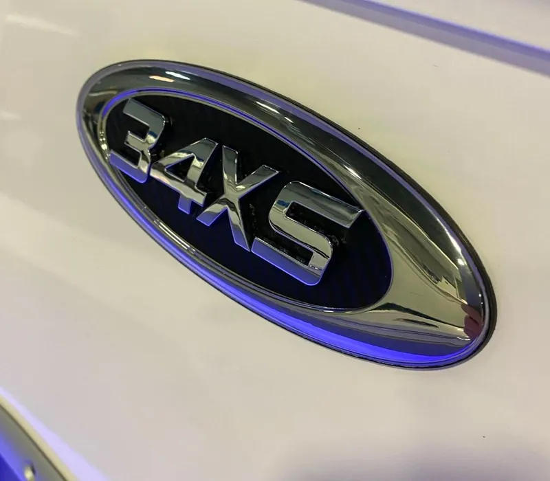 Slide: The Image of Chrome emblem of 2025 Cape Horn 34 XS boat on white surface. - 19