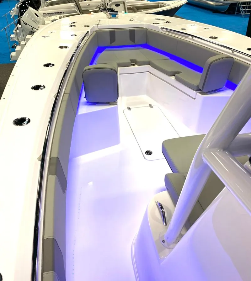 Slide: The Image of 2025 Cape Horn 34 XS boat interior with modern seating and ambient lighting. - 26