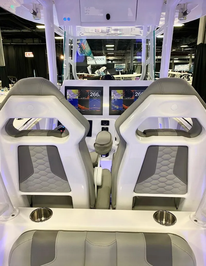 Slide: The Image of 2025 Cape Horn 34 XS boat interior with dual screens and modern seating. - 29