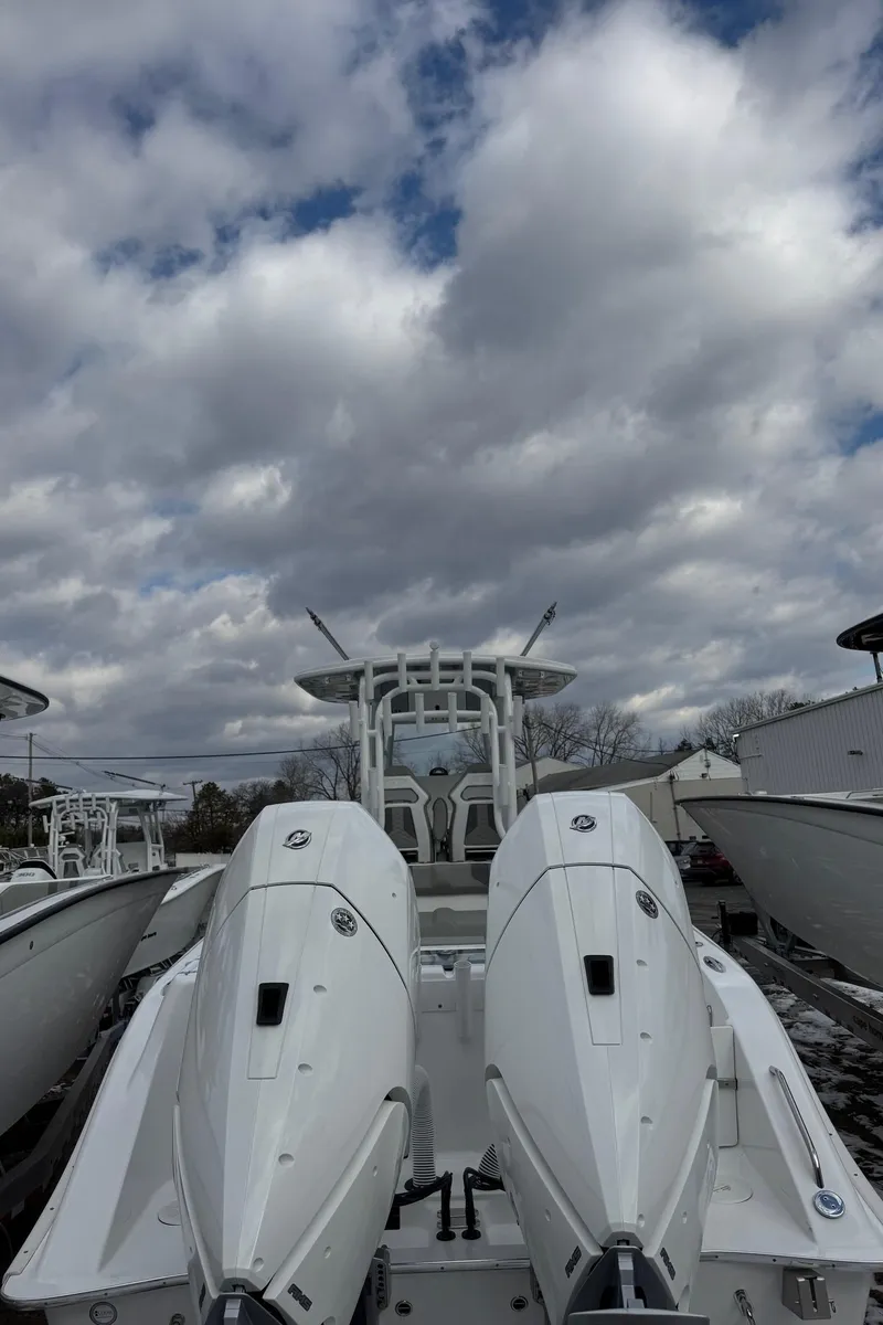Slide: The Image of 2025 Cape Horn 34 XS boat with dual engines under cloudy sky. - 3